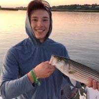 Peter Chinburg poses with a fish he just caught