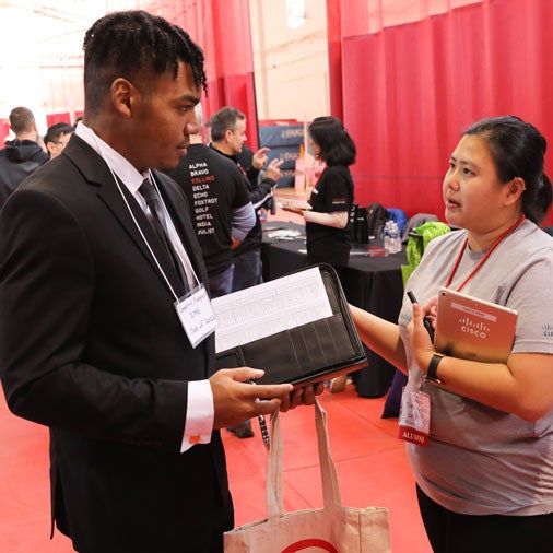 Student meets with industry representative at Career Fair