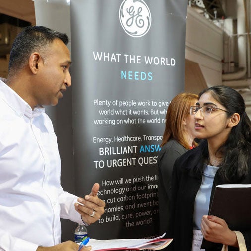 Student meets with GE rep at Career Fair